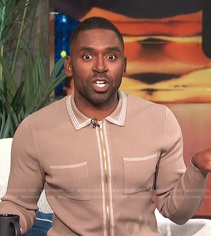 Justin’s beige zip front polo shirt on E! News Daily Pop
