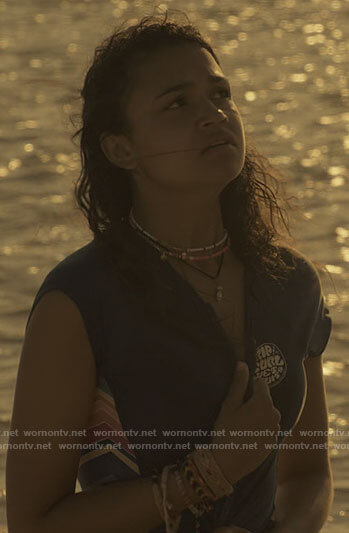 Kiara’s blue rash guard with rainbow stripes on Outer Banks