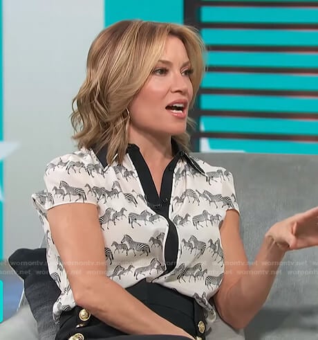 Kit’s zebra print blouse and button detail pants on Access Hollywood