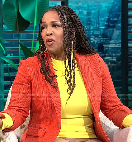 Kym’s yellow top and orange herringbone blazer on E! News Daily Pop