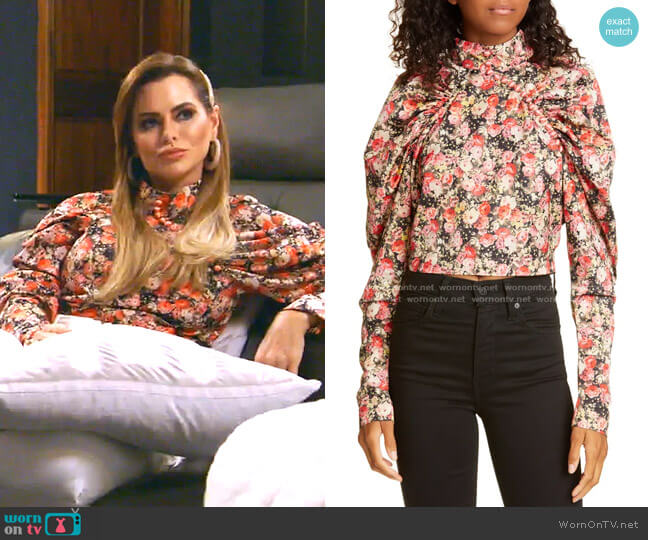 Rotate Kim Floral Puff Sleeve Crop Top worn by D’Andra Simmons on The Real Housewives of Dallas