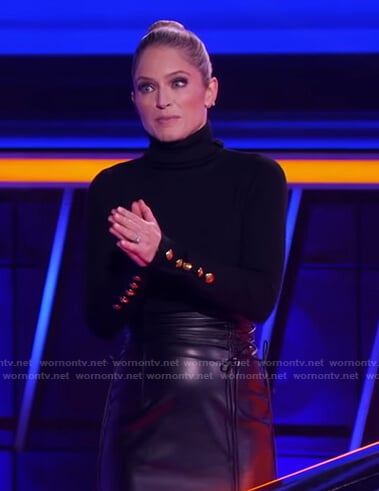 Sara’s black turtleneck sweater with gold buttons and skirt on The Chase