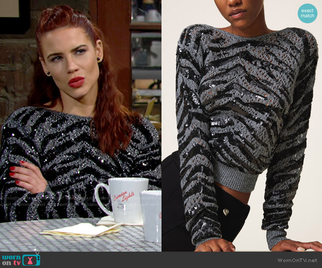 Twinset Reversible jumper with animal pattern sequins worn by Sally Spectra (Courtney Hope) on The Young and the Restless
