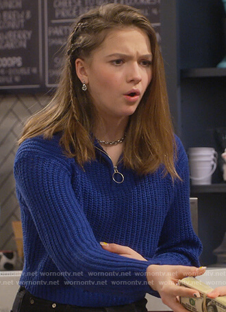 Presley’s blue knit sweater on Side Hustle