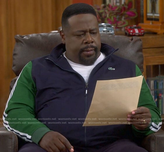 Calvin’s navy track jacket with green sleeves on The Neighborhood