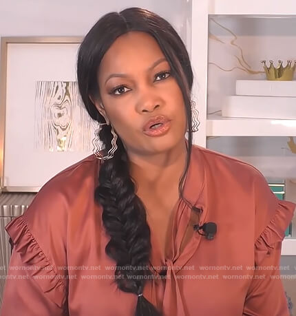 Garcelle’s satin ruffle tie blouse on The Real