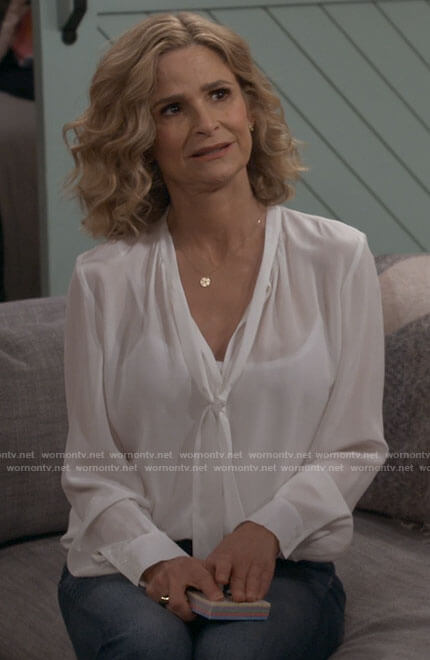 Jean’s white tie neck blouse on Call Your Mother