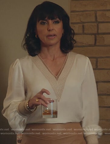 Kathleen’s white eyelet trim v-neck blouse on Good Trouble