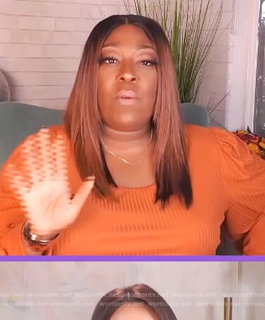 Loni’s orange tie waist jumpsuit on The Real