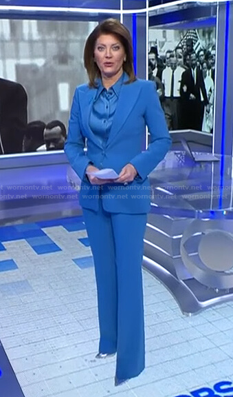 Norah’s blue satin shirt and peak lapel blazer on CBS Evening News