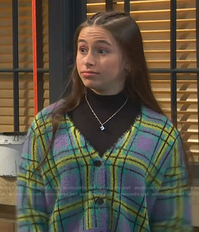 Tess’s purple plaid cardigan on Ravens Home