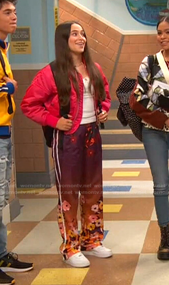 Tess’s pink bomber jacket and floral pants on Ravens Home