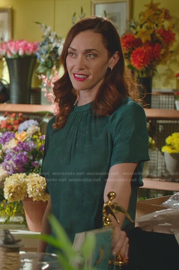 Abigail’s green gathered neck top on Good Witch