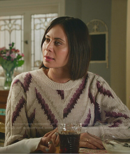 Cassie’s white chevron stripe sweater on Good Witch