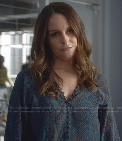 Izzy’s blue snakeskin print blouse on Bull