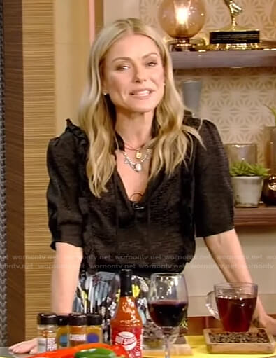 Kelly’s black tie neck top and floral skrit on Live with Kelly and Ryan