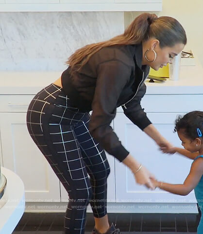 Khloe’s black sheer jacket and check pants on Keeping Up with the Kardashians