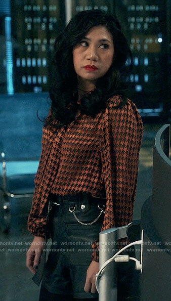Mel’s houndstooth blouse and leather shorts on The Equalizer