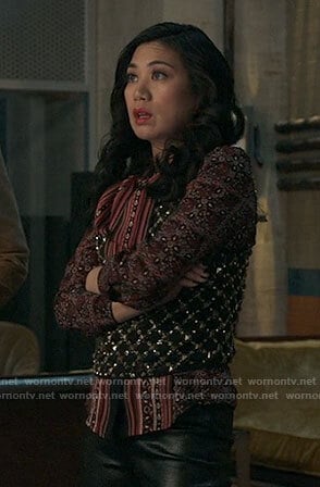 Mel’s pink printed blouse and studded top on The Equalizer