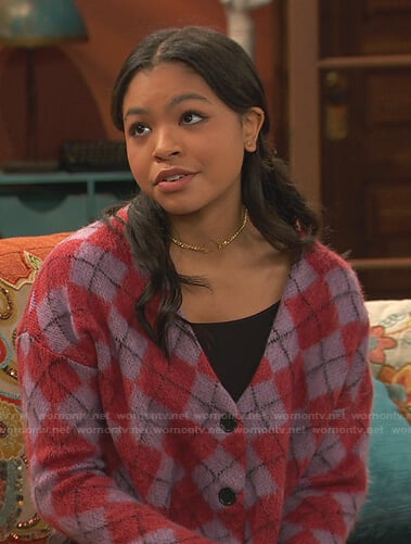 Nia’s purple argyle cardigan on Ravens Home