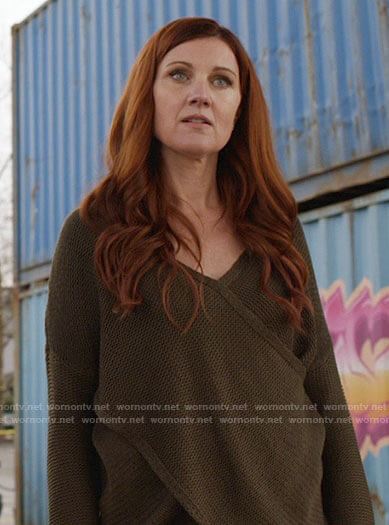 Nora’s olive green crossover sweater on The Flash