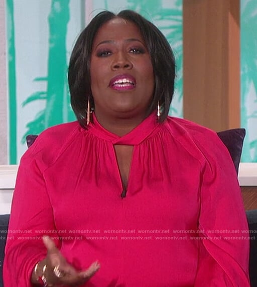 Sheryl’s pink keyhole satin blouse on The Talk