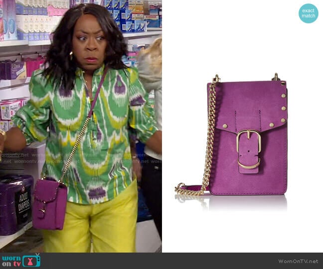Rebecca Minkoff Biker Phone Crossbody worn by Tina Butler (Tichina Arnold) on The Neighborhood