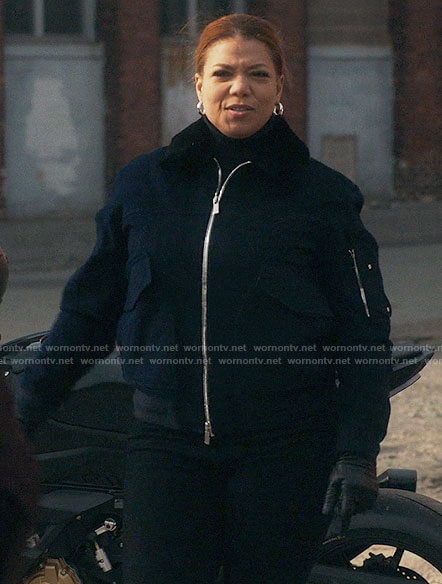 Robyn’s navy bomber jacket with fur collar on The Equalizer