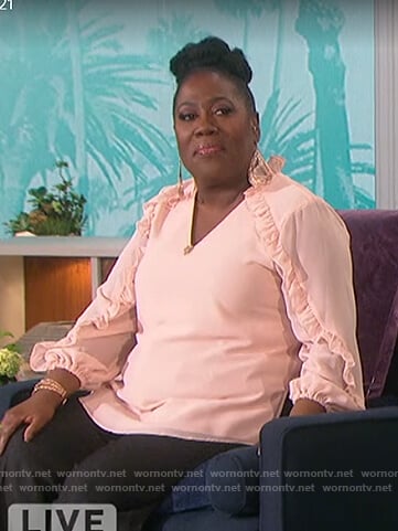 Sheryl’s pink ruffle trim top on The Talk