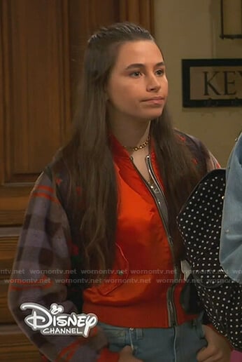 Tess’s orange plaid-sleeve bomber jacket on Ravens Home