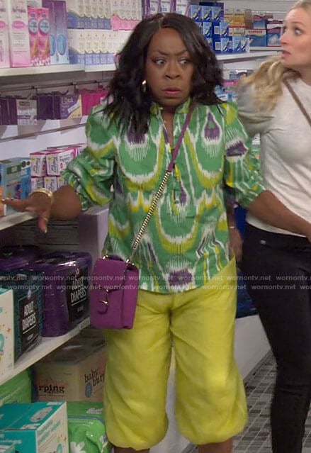 Tina’s green printed top on The Neighborhood