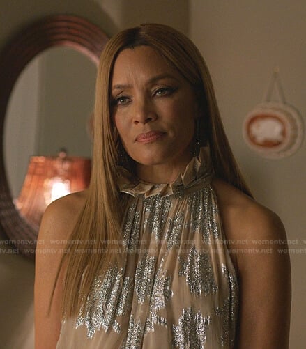 Dominique’s metallic ruffle neck top and pleated skirt on Dynasty
