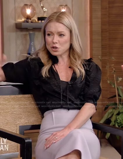 Kelly’s black tie neck top and grey pencil skirt on Live with Kelly and Ryan