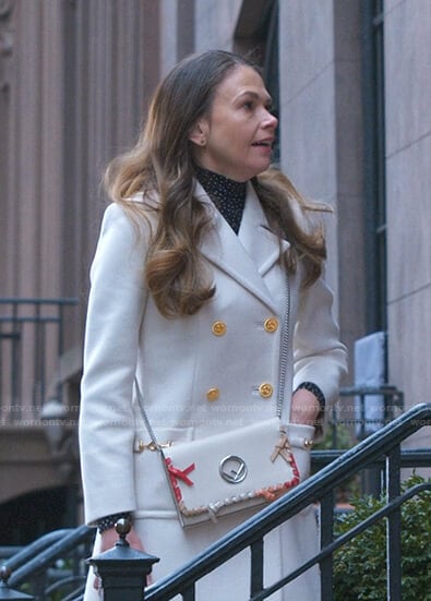 Liza’s white double breasted coat on Younger