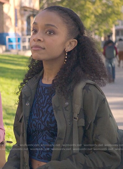 Mia’s blue textured crop top and green star print jacket on Love Victor