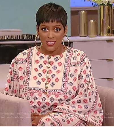 Tamron’s white floral printed kaftan dress on Tamron Hall Show
