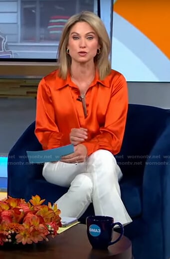 Amy’s orange blouse and white cropped pants on Good Morning America