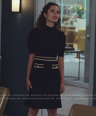 Isabel’s black contrast trim dress on The Good Fight