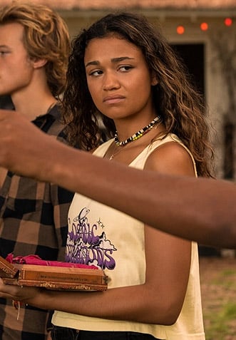 Kiara’s cosmic vibrations graphic tank top on Outer Banks