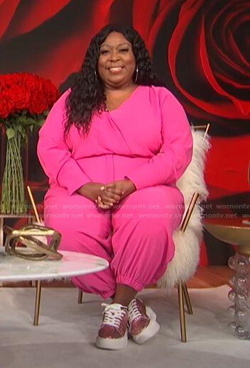 Loni’s pink surplice jumpsuit on E! News Daily Pop