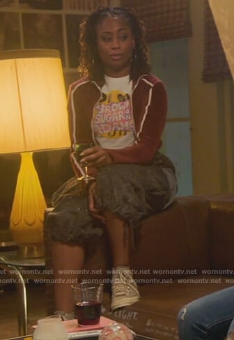 Malika’s red velour stripe sleeve jacket on Good Trouble