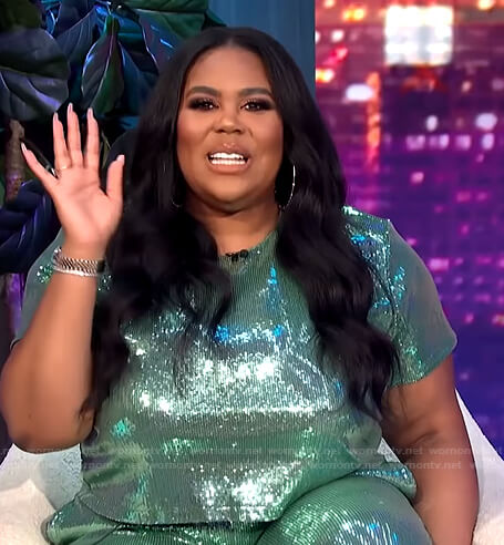 Nina’s green sequin top and pants on E! News Nightly Pop