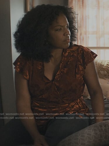 Nina’s orange floral wrap top on The Chi