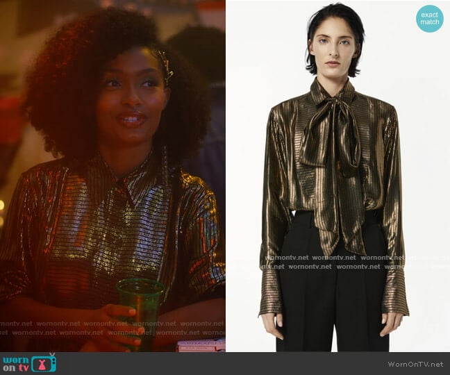 Victoria Beckham Bib-Front Metallic Striped Tie-Neck Blouse worn by Zoey Johnson (Yara Shahidi) on Grown-ish