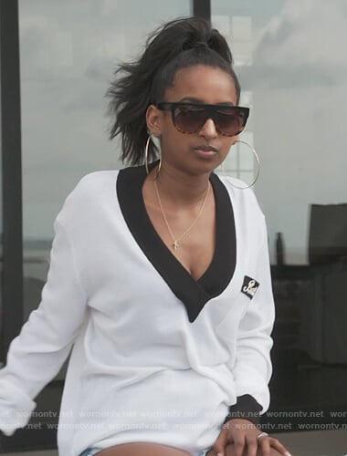 Askale Davis’s white contrast v-neck sweater on The Real Housewives of Potomac