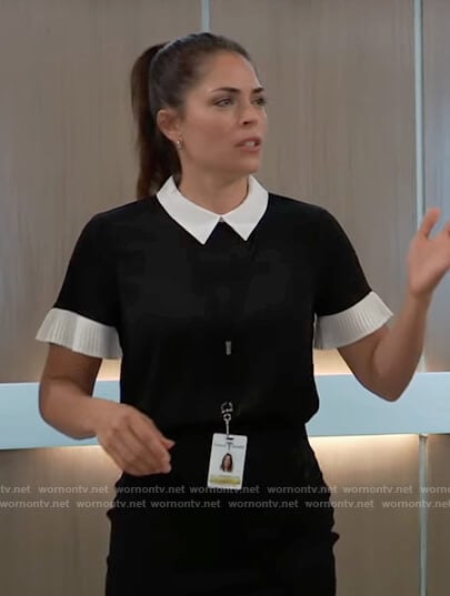 Britt’s black contrast pleated blouse on General Hospital
