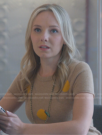 Claire’s beige fruit print sweater on Good Trouble