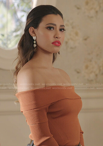 Eva’s orange ribbed off-shoulder top on Dynasty
