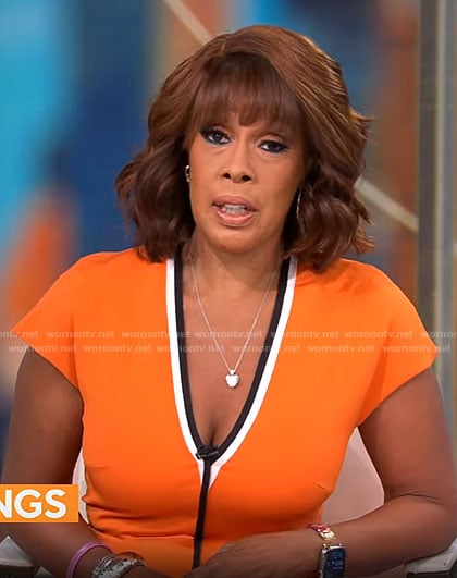 Gayle King’s orange v-neck dress with black trim on CBS This Morning