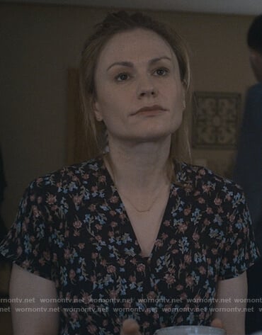 Isabelle’s black floral v-neck top on Modern Love